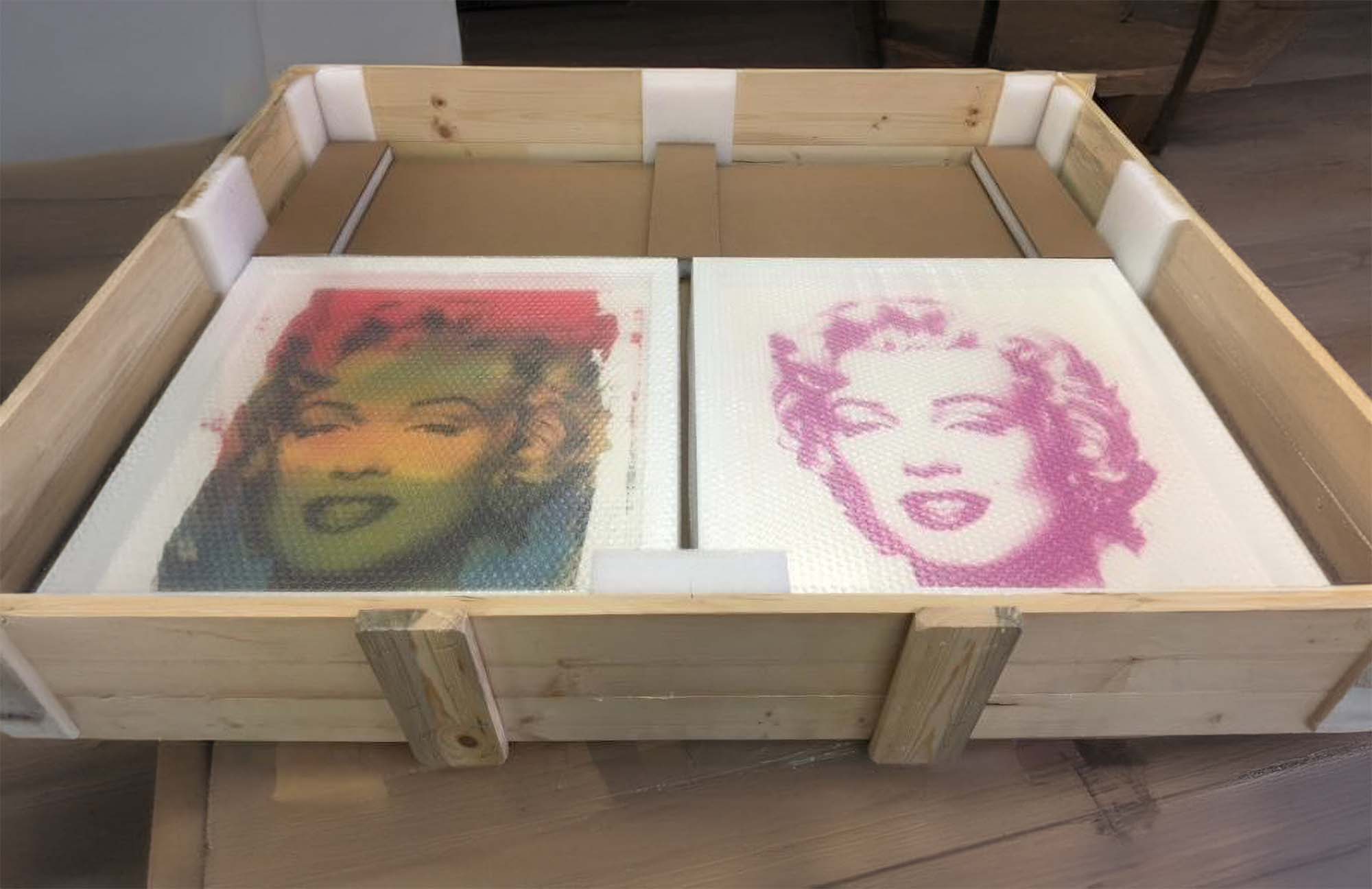 unframed Warhol prints, part of entire art collection - packed and shipped in one crate by Goodman Packing & Shipping